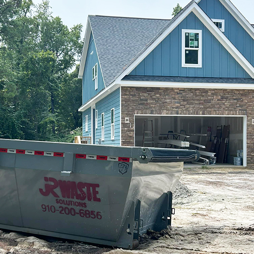 JR Waste dumpster outside of new home